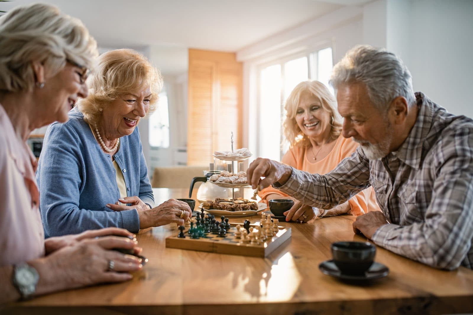 Seniors playing chess — active independent lifestyle