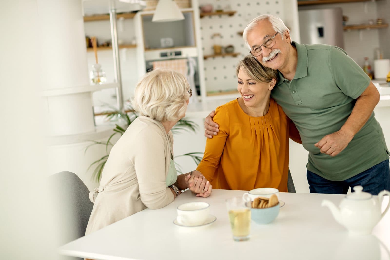 Senior couple happy with a family visit at a California care home