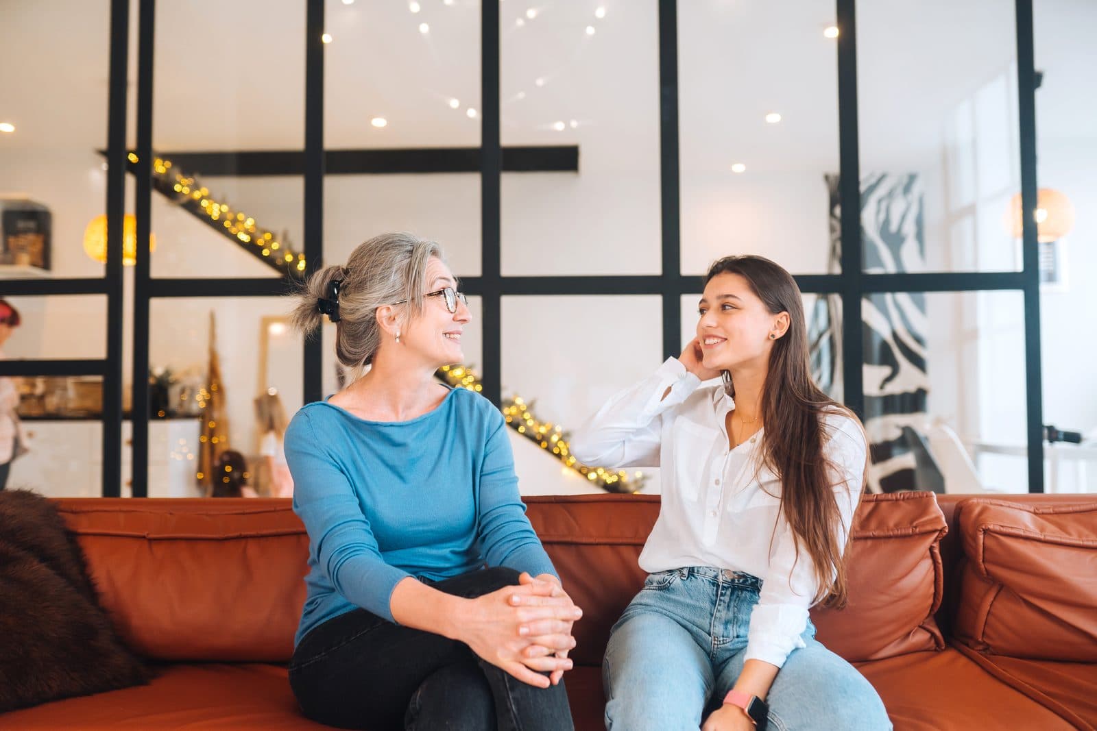 A woman talking with her grandmother at home about care options