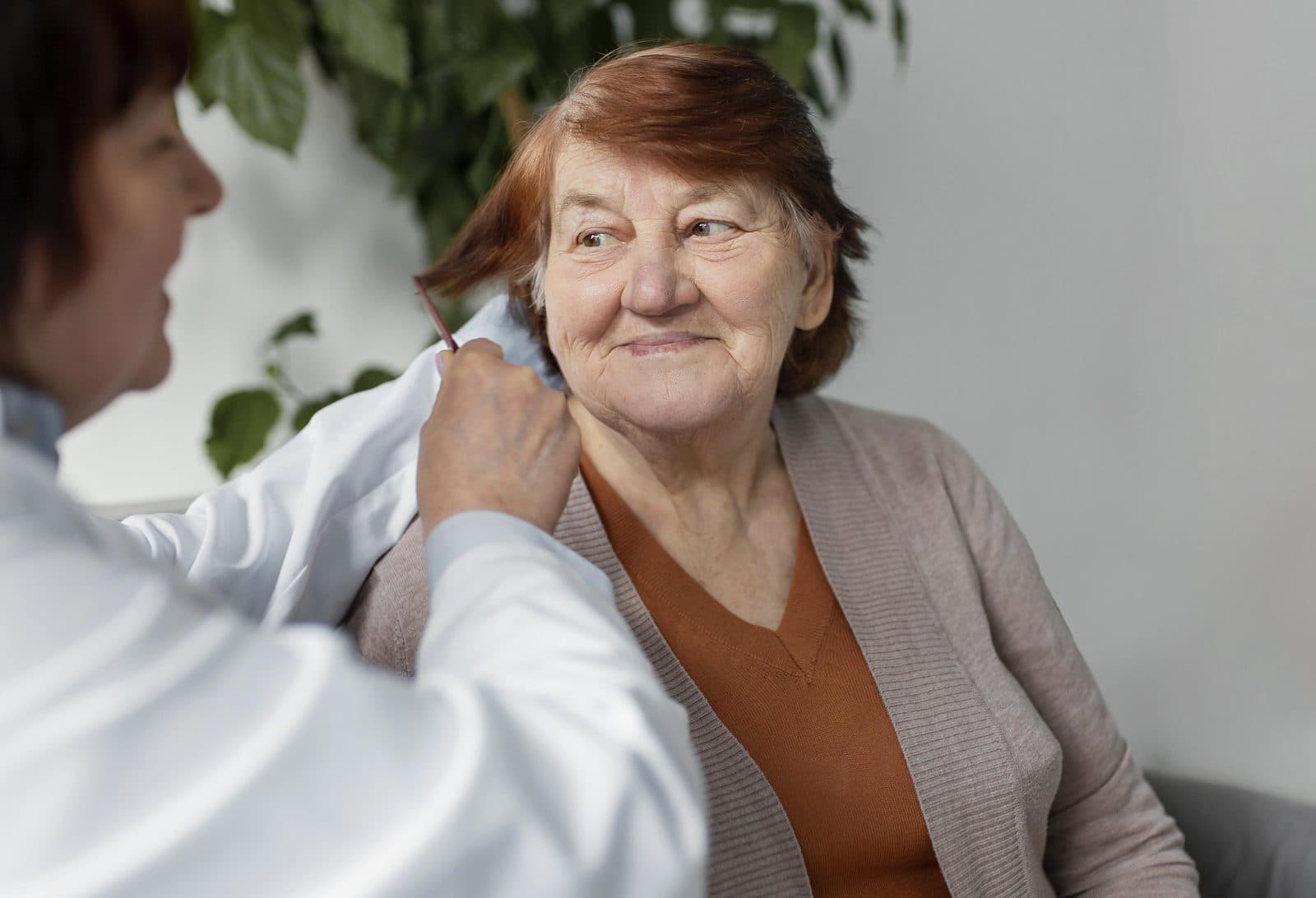 Caregiver providing personal care — memory care setting